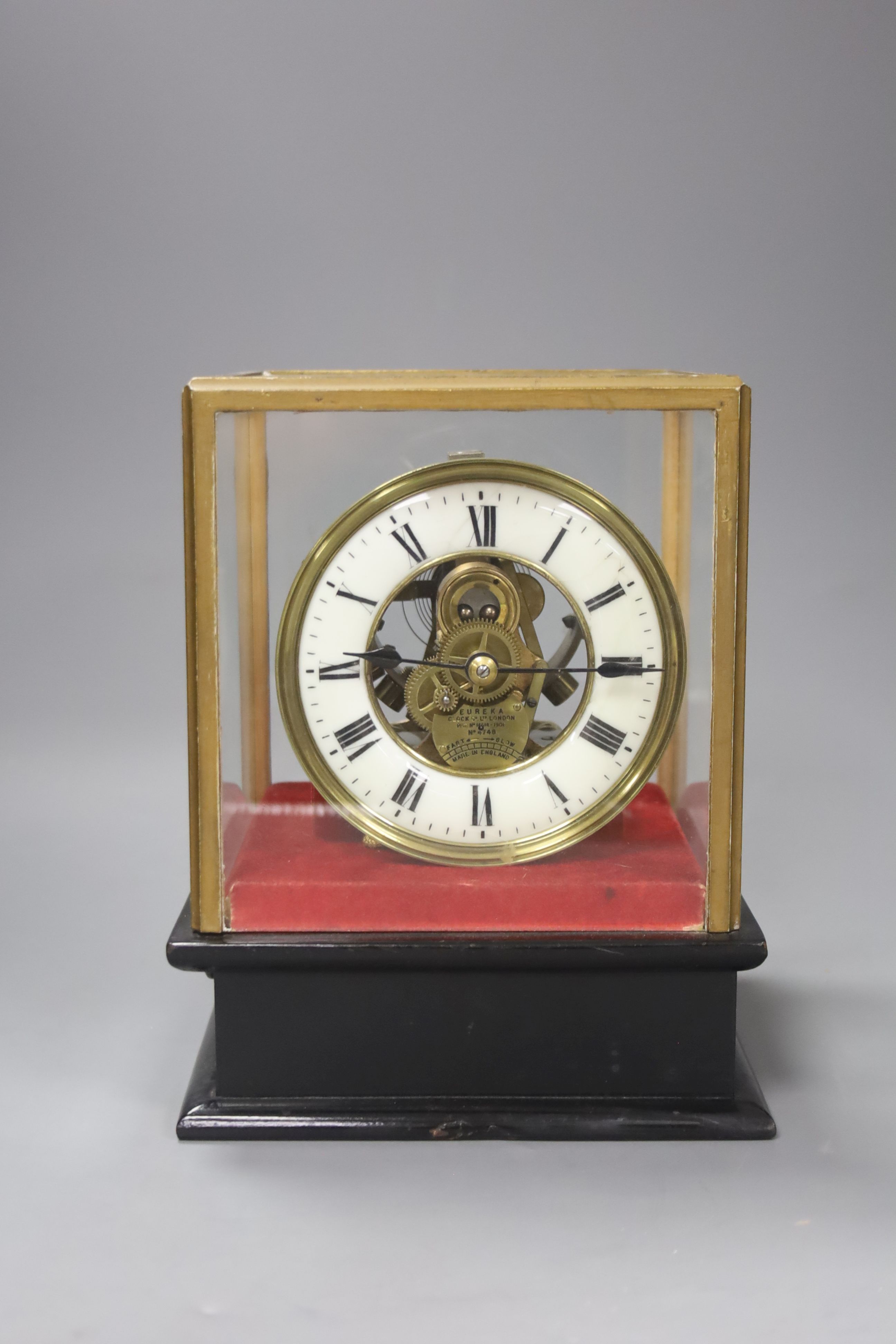 A Eureka Clock Co. Ltd electric clock in four glass case